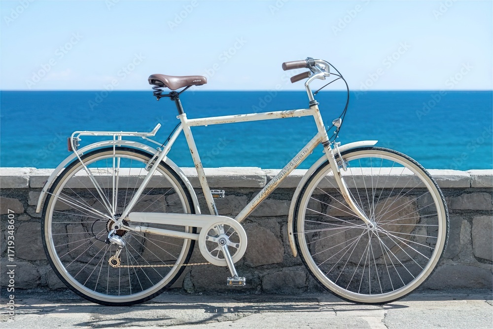 Fototapeta premium vintage bicycle parked near sea wall. Travel and summer vacation