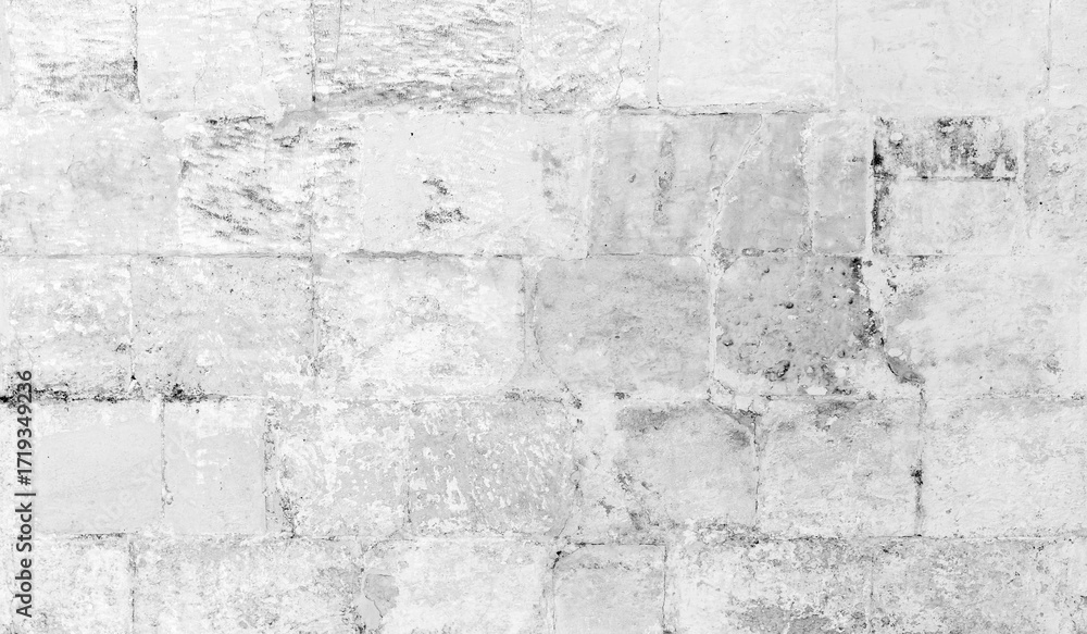 Fototapeta premium Grungy white wall made of rough yellow bricks