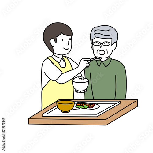 高齢者の食事介助をする介護士