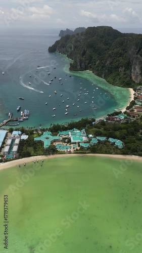 Drone video in portrait of Koh Phi Phi Don with Longtail Boats