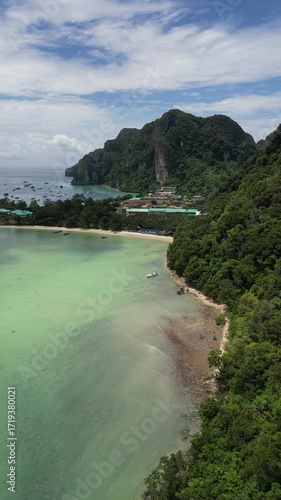Drone video in portrait of Koh Phi Phi Don with Longtail Boats