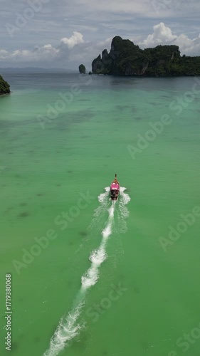 Drone video in portrait of Koh Phi Phi Don with Longtail Boats