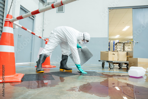 people cleaning chemical leak absorbent