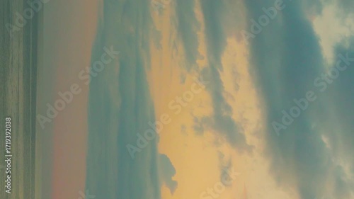 Vertical, Ocean Yellow Red Sunset Sky with Srorm Blue Gray Cumulus Clouds, Beautiful Seascape Sea and Sky with Rainy Clouds, Aerial Sea View, Vacation, Tourism, Beauty, Planet, Background, Nobody.