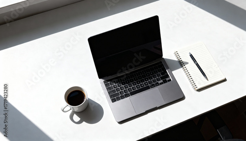 Minimalist Workspace Flat Lay with Laptop, Notebook, Pen, and Coffee on White Desk