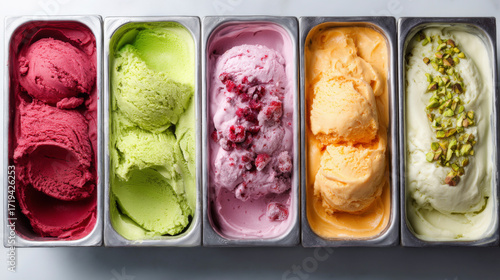 Multi-colored ice cream: strawberry taste, green apple taste, raspberry taste, mango taste and pistachio taste in metal trays in the refrigerator in candy store. Generative AI image