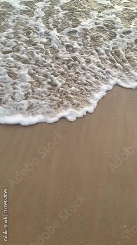 Super slow motion video of waves rushing to the beach - sunset on the beach