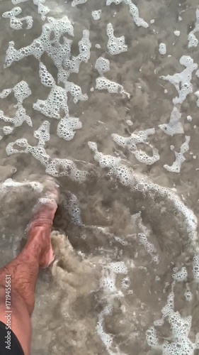 Super slow motion video of waves rushing to the beach - sunset on the beach