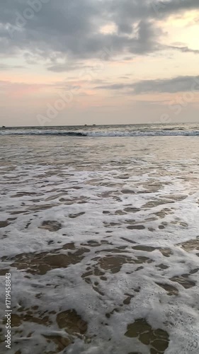 Super slow motion video of waves rushing to the beach - sunset on the beach