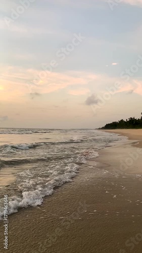 Super slow motion video of waves rushing to the beach - sunset on the beach