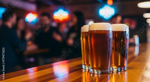 Close up of several fresh beer glasses on wooden bar counter. Craft brewery bar setting for celebrating, party concept