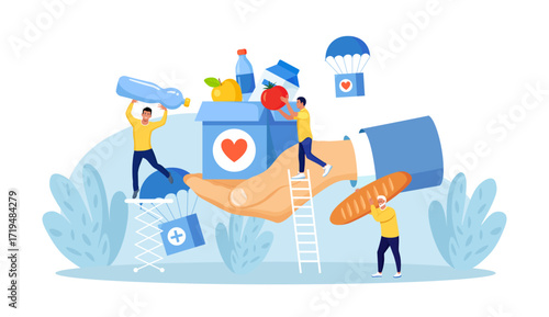 Humanitarian Aid, Food Donation for Poor People, Refugees. Team of Volunteers Collecting Help Boxes to Shelters, Filling Cardboard Donation Box with Products, Groceries. Charity People Sharing Food