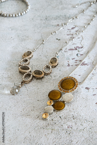 Antique jewelry, vintage necklaces on a rustic background