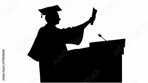 Silhouette of graduate in cap and gown holding diploma at podium with microphone giving speech ceremony