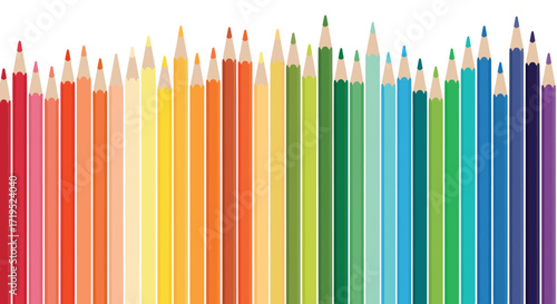 A vibrant collection of colored pencils arranged in a rainbow spectrum.