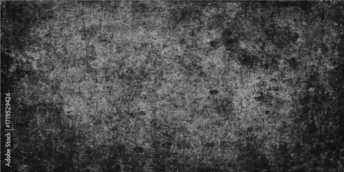 Dark gray grunge wall with a rough, aged concrete texture and a vintage black and white pattern for a grungy backdrop