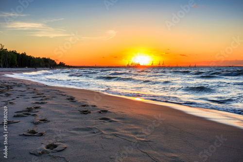 Fototapeta Naklejka Na Ścianę i Meble -  Sunset over the Baltic Sea beach in Gorki Zachodnie, Gdansk. Poland