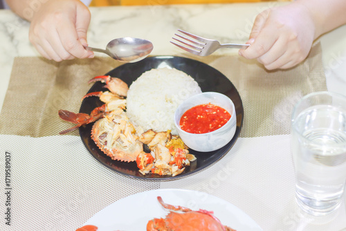 Person About to Eat Picked Mud Crab with Rice