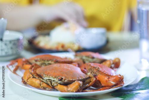 4 Cooked Mud Crabs on a White Plate