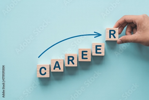 Hand placing wooden blocks spelling career with arrow showing professional growth progress.