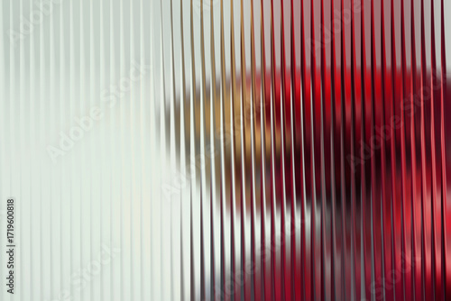 Abstract vertical ribbed texture with blurred colorful shapes creating a sense of depth and intrigue