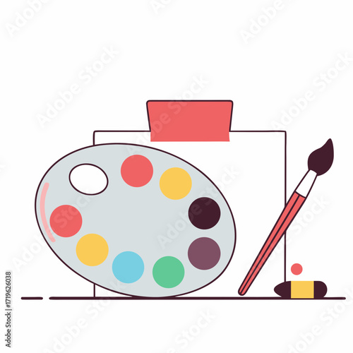 Colorful artist palette with paintbrush and canvas in an art studio setting during daytime