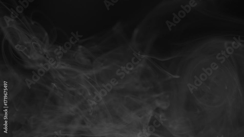 Ethereal smoke or mist drifting on black background. Seamless video footage for overlay effects in post-production and creative projects.
