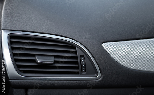 the front black panel of the car's interior with a fan and the inscription ''airbag''
