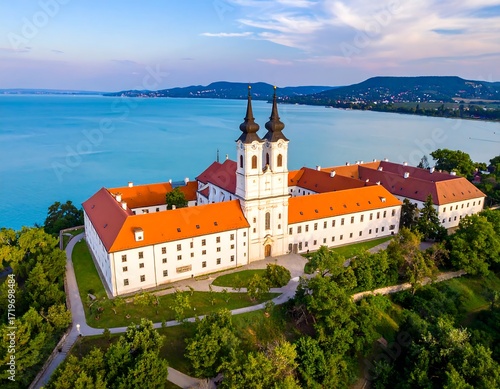 Aerial view of a historic abbey overlooking a lake