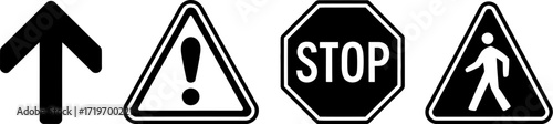 Collection of black and white traffic and warning signs, including a pedestrian crossing, stop sign, and directional arrow.