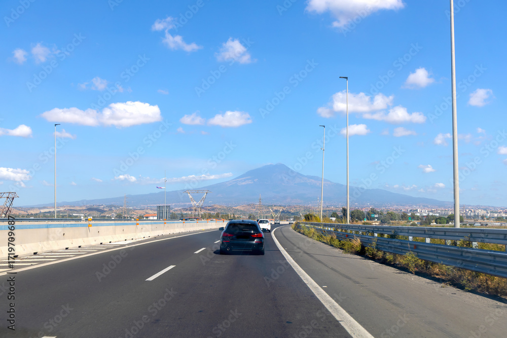 Fototapeta premium Highway view with Mount Etna volcano