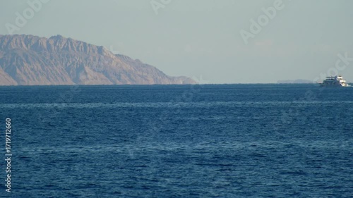 Ship vessel sails in the Red Sea off the coast of Tiran Island.