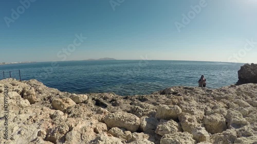 Vacationers on a picturesque Egyptian beach on the Red Sea opposite Tiran Island 