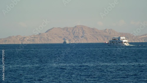Ships vessels sails in the Red Sea off the coast of Tiran Island 