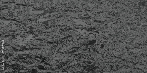Abstract dark gray textured background with organic swirling patterns and subtle highlights creating a sense of depth and movement for design projects