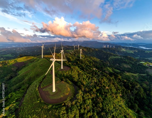 Aerial view of wind turbines on lush hills