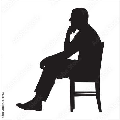Silhouette of a man sitting on a chair, thinking