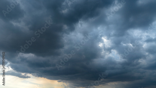 Cloudy sky ready for a storm. The clouds are dark and darken the sky. Ideal for backgrounds, textures and patterns.