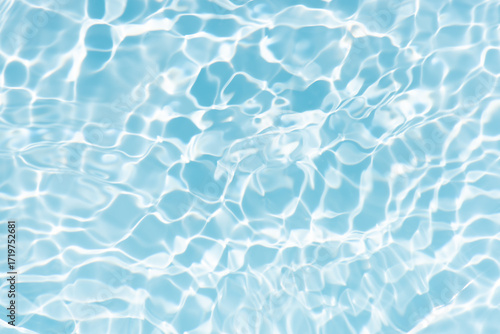 Blue water with ripples on the surface. Defocus blurred transparent blue colored clear calm water surface texture with splashes and bubbles. Water waves with shining pattern texture background.