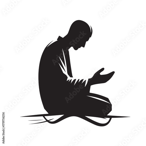 Man performing islamic prayer in a dark silhouette