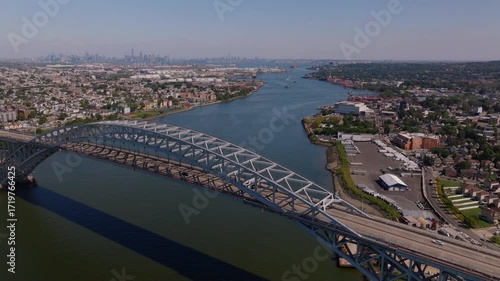 Wallpaper Mural Aerial drone footage of the Bayonne Bridge spanning the Kill Van Kull waterway with Bayonne New Jersey on one side and Staten Island New York on the other and Manhattan skyline in the distance ProRes  Torontodigital.ca