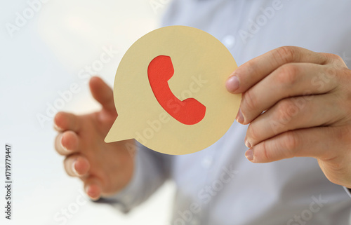 Image of a person holding a...