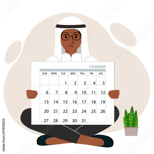 A man sits cross-legged and holds a large calendar glider in his hands. Concept of planning, make plans, schedule, event.