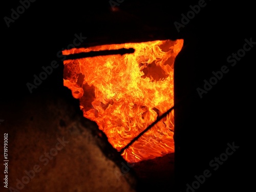 Flame, fire, building fire, intensity of fire inside a room, room for fire training for firefighters, damage caused by fire.