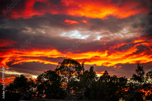 The background of the twilight sunset, the sky has beautiful changes, amidst the green fields and various trees, there is a cool breeze blowing throughout the journey to the viewpoint.