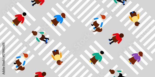 Diverse group of people walking across a pedestrian crossing in a city street from an aerial perspective