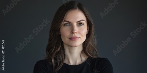 Confident Woman Portrait Against a Dark Background, Perfect for Professional Use