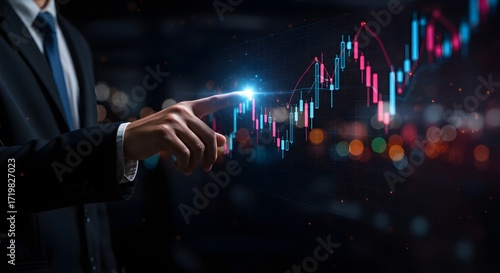 Businessman's hand pointing at a futuristic stock market graph with glowing data and bokeh background