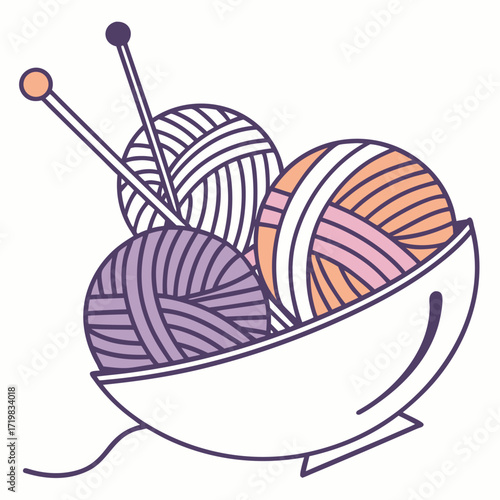 Bowl filled with colorful yarn and knitting needles