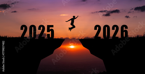 Silhouette of a person jumping from 2025 to 2026 over a gap between cliffs at sunset, symbolizing new year, transition, progress, opportunities, future,